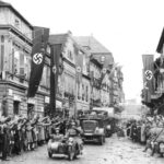 German streets decorated with swastika flags and banners.