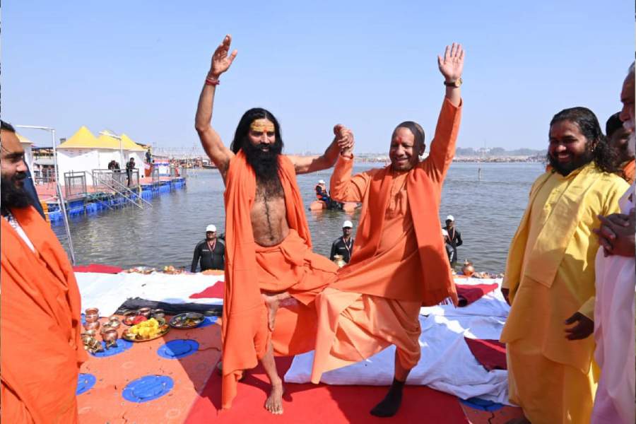 Uttar Pradesh Chief Minister Yogi Adityanath with Yog Guru Baba Ramdev during Mahakumbh Mela, at the Sangam in Prayagraj